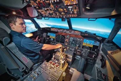 Pilot inside the cockpit of an aircraft.