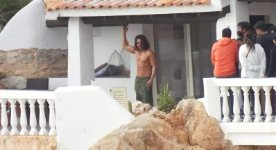 The viral images feature shirtless King Khan showing off his ripped abs