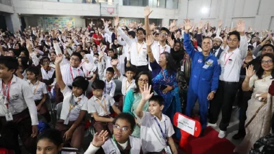 Acaba with students.
