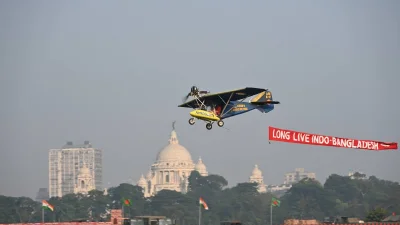 A small plane carrying a banner. 